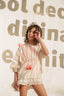 STRIPED COVER-UP WITH POMPOMS