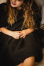 BLACK CURLY DRESS.
