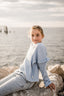 LONG SLEEVE BLUE SHIRT WITH FRILLS.
